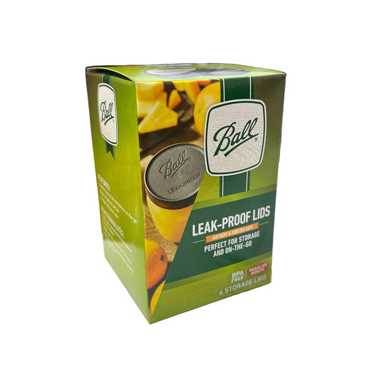 Box of Bilt leak-proof lids on a table with blurred background