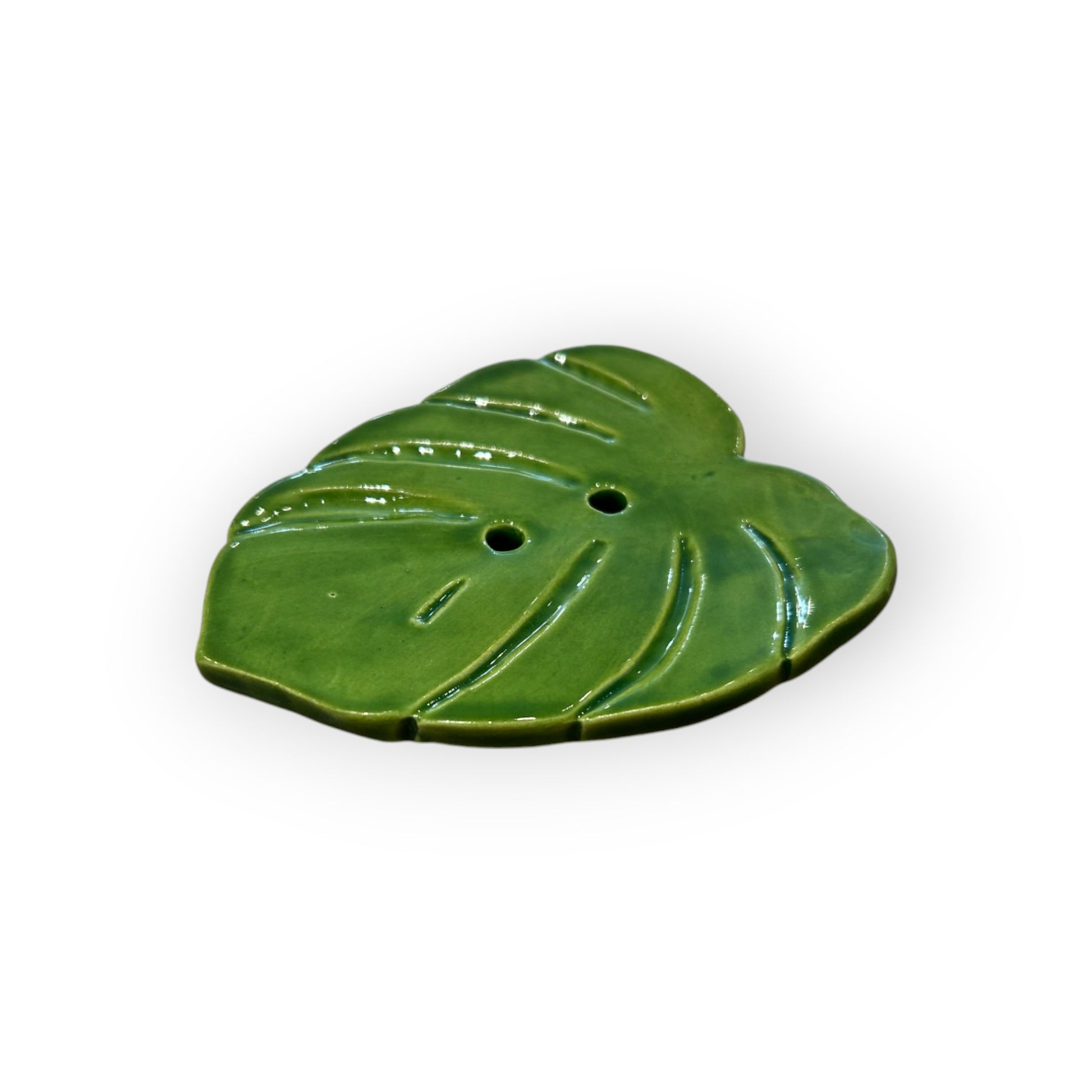 Handmade Monstera leaf soap dish with a natural ceramic finish.