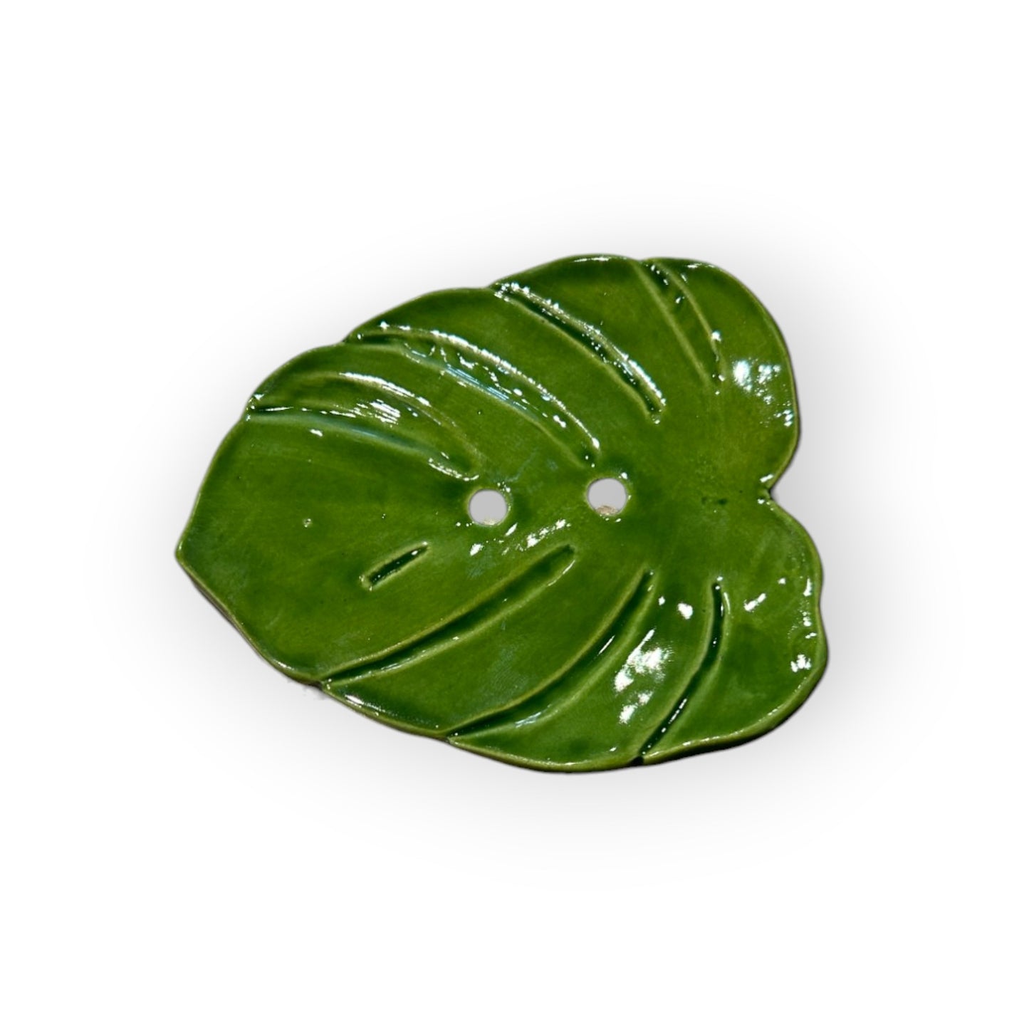 Close-up of Monstera leaf soap dish showcasing detailed veins and drainage design.